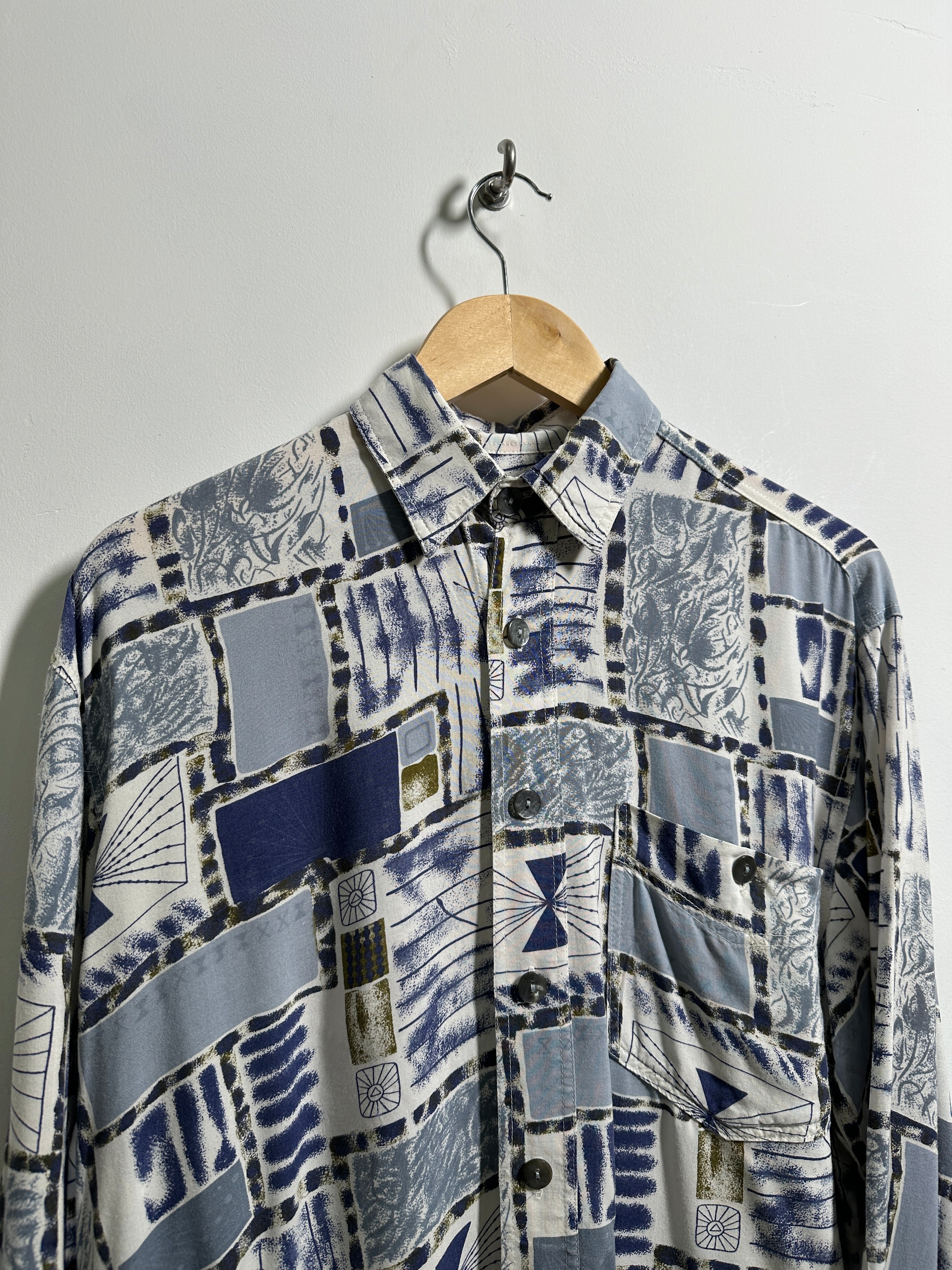 Vintage long-sleeve shirt with blue and white patterns - thrift.mt